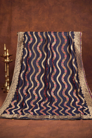 Navy blue silk dupatta with wavy gold zari leheriya stripes, pink and orange meenakari vines and gold kiran lace edging