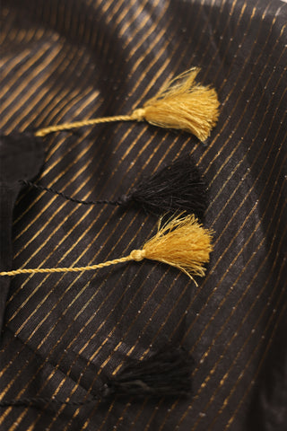 Luxe black linen saree with gold zari stripes and tassel pallu
