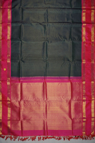 Deep bottle green Kanjivaram silk saree with gold checks and a rani pink elephant and peacock border