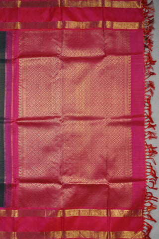 Deep bottle green Kanjivaram silk saree with gold checks and a rani pink elephant and peacock border