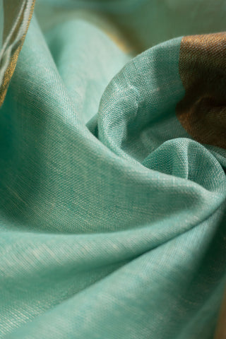 Aqua green handloom linen saree with gold zari