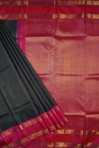 Deep bottle green Kanjivaram silk saree with gold checks and a rani pink elephant and peacock border