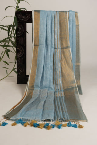 Sky blue linen saree with gold and grey zari border
