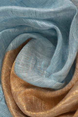 Sky blue linen saree with gold and grey zari border