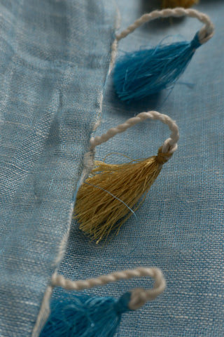 Sky blue linen saree with gold and grey zari border