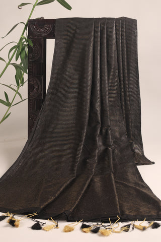 Luxe black linen saree with gold zari stripes and tassel pallu