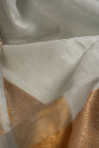 White linen saree with gold zari border