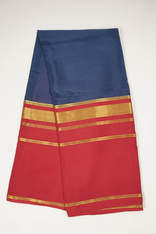 Navy blue crepe silk saree with red zari pallu