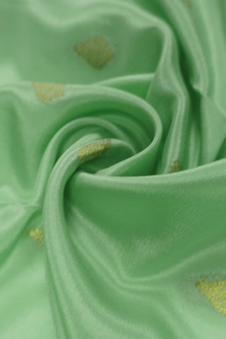 pista green crepe silk saree with purple zari pallu