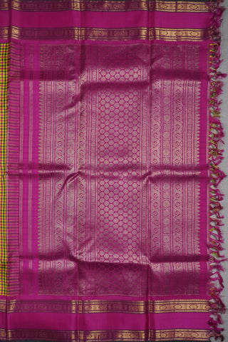 Yellow, green and rani pink micro check Kanjivaram silk cotton saree with a rani pink gold zari border
