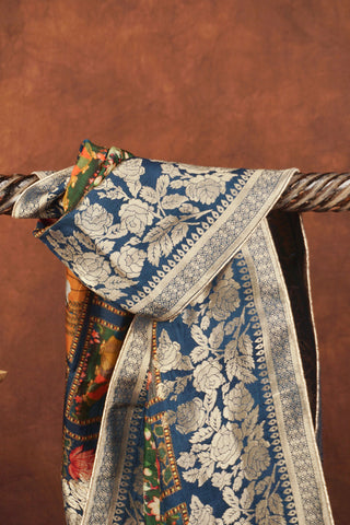 Multicolor Pichwai printed Dola silk dupatta with lotus ponds and kamdhenu motifs, royal blue silver zari floral border