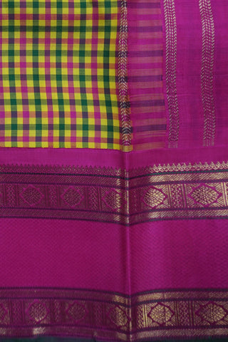 Yellow, green and rani pink micro check Kanjivaram silk cotton saree with a rani pink gold zari border