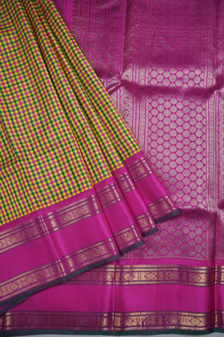 Yellow, green and rani pink micro check Kanjivaram silk cotton saree with a rani pink gold zari border