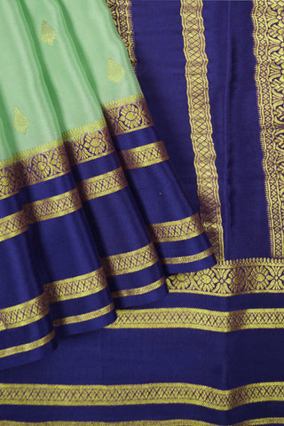 pista green crepe silk saree with purple zari pallu