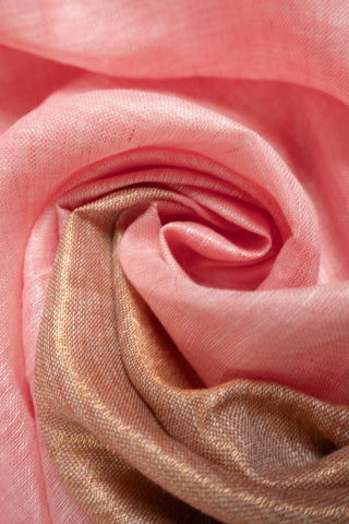 Pastel pink linen saree with red border and tassels
