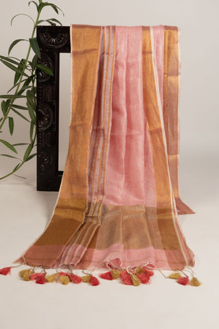 Pastel pink linen saree with red border and tassels