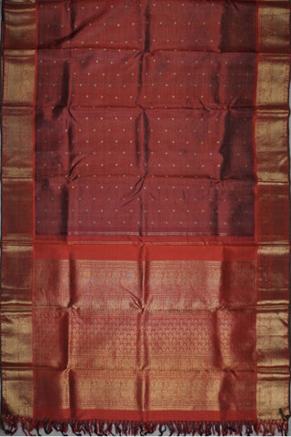 Dull maroon shot silk Kanjivaram saree with gold zari peacock border and crimson brocade pallu