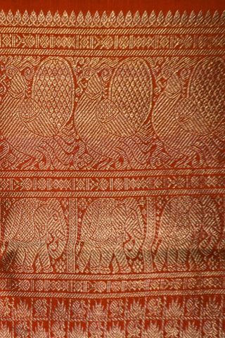 Dull maroon shot silk Kanjivaram saree with gold zari peacock border and crimson brocade pallu
