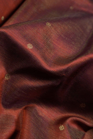Dull maroon shot silk Kanjivaram saree with gold zari peacock border and crimson brocade pallu