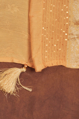 Light yellow jacquard dupatta with woven floral texture, fine sequins, silver Banarasi zari borders and tassels