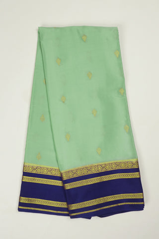 pista green crepe silk saree with purple zari pallu