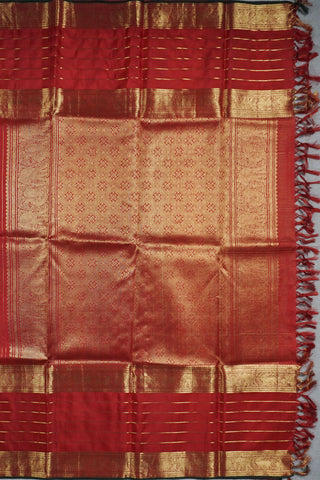 Ruby red Kanjivaram silk saree with gold micro checks, floral buttas and a bottle green selvedge border