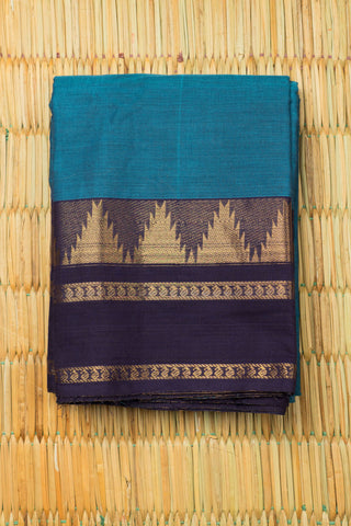 Teal blue Chettinad cotton saree with navy blue and gold woven border and subtle stripes
