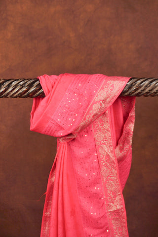 Fuchsia pink jacquard dupatta with sequin embellishments, silver Banarasi zari floral borders and beaded tassels