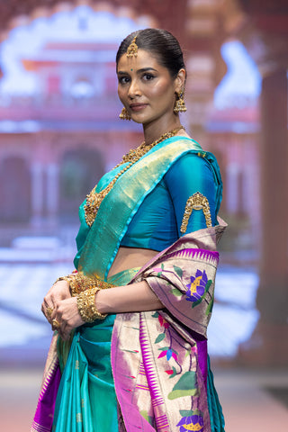 Turquoise blue Kanjivaram silk saree with gold zari border and pallu