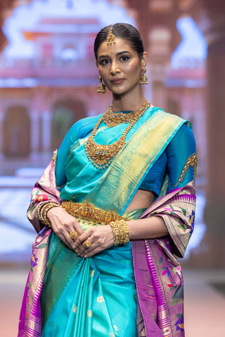 Turquoise blue Kanjivaram silk saree with gold zari border and pallu
