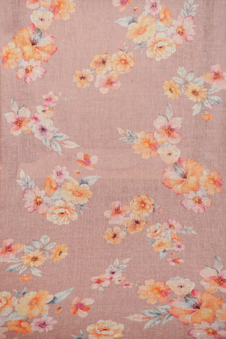 Lilac linen saree with watercolour-style floral prints in peach, yellow and blush, silver zari selvedge and tassels
