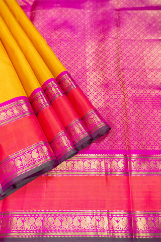 Mustard and rani pink handloom Kanjivaram silk saree with zari border