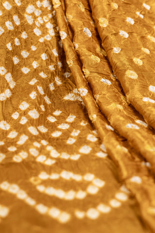 Mustard Yellow Modal Satin Bandhani Saree with zari border