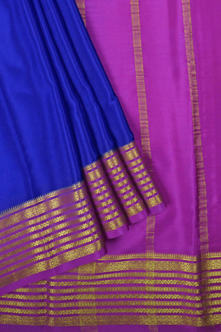 royal blue crepe silk saree with magenta zari pallu