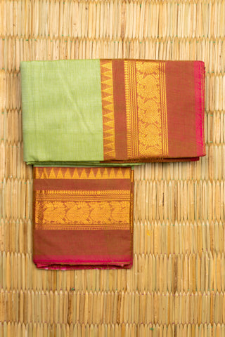 Pista green Chettinad cotton saree with rust-red and gold peacock border