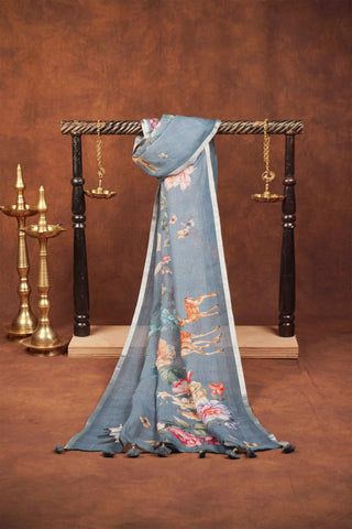 Greyish blue digital printed linen saree with floral blooms, white cranes, deer and butterflies, silver zari selvedge