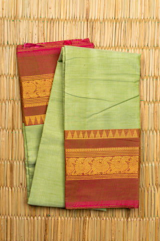 Pista green Chettinad cotton saree with rust-red and gold peacock border