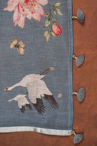 Greyish blue digital printed linen saree with floral blooms, white cranes, deer and butterflies, silver zari selvedge