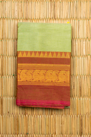 Pista green Chettinad cotton saree with rust-red and gold peacock border
