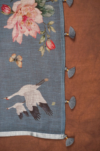 Greyish blue digital printed linen saree with floral blooms, white cranes, deer and butterflies, silver zari selvedge