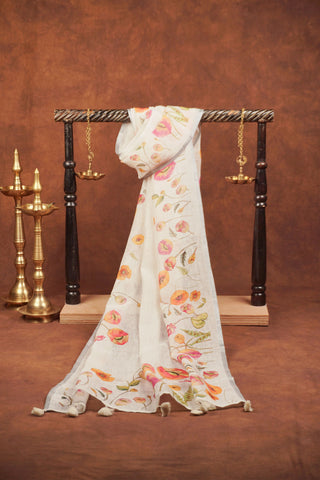 White linen dupatta with pink and peach poppy floral borders, green foliage, silver zari selvage and white tassels