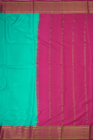 aqua blue crepe silk saree with rani pink pallu