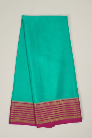 aqua blue crepe silk saree with rani pink pallu