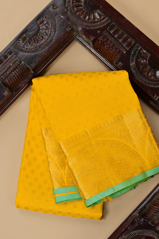 Radiant Yellow Kanjivaram Silk Saree with Green Trim and Self-Weave Motifs