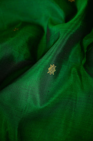 Bottle green Kanjivaram silk saree with red zari and gold motifs