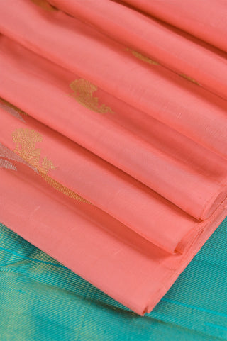 Peach Kanjivaram silk saree with blue pallu and gold motifs