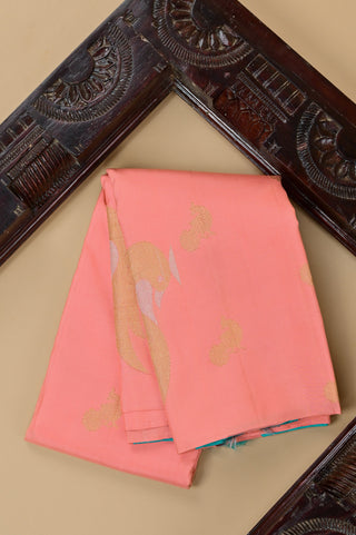 Peach Kanjivaram silk saree with blue pallu and gold motifs
