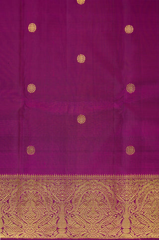Purple Kanjivaram silk saree with gold zari and traditional peacock border