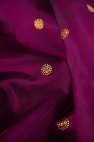Purple Kanjivaram silk saree with gold zari and traditional peacock border