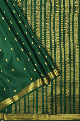 emerald green crepe silk saree with floral zari buttas
